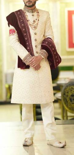 Off white embroidery sherwani with collar embellishment.