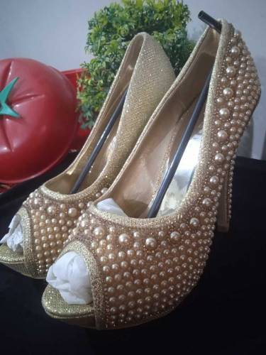 Golden pearl heels