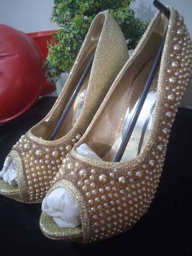 Golden pearl heels
