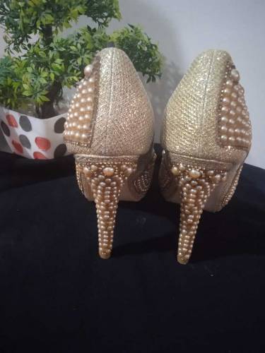 Golden pearl heels