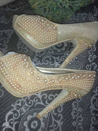Golden pearl heels