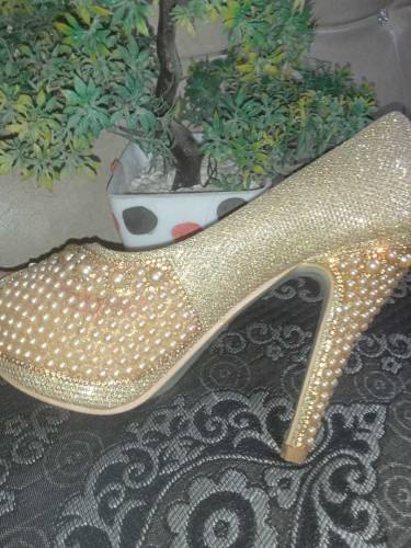 Golden pearl heels