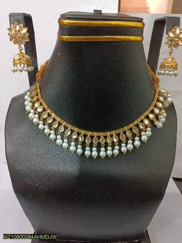 •  Base Metal: Alloy•  Golden Polish•  Stones Work•  Necklace Set With