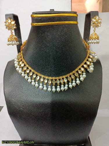 •  Base Metal: Alloy•  Golden Polish•  Stones Work•  Necklace Set With