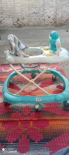 Baby walker 09/10 condition , music system