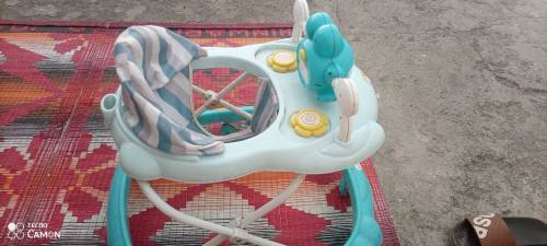 Baby walker 09/10 condition , music system