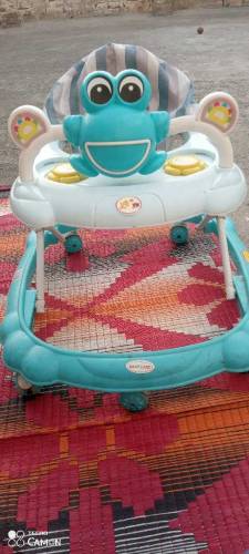 Baby walker 09/10 condition , music system
