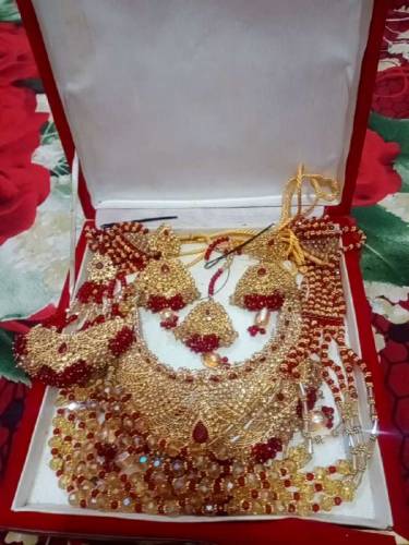 bridal lengha with beautiful jwellary purse and sandle