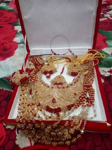 bridal lengha with beautiful jwellary purse and sandle