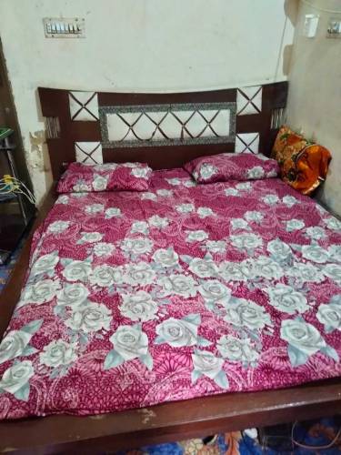 Bed with matress and cupboard
