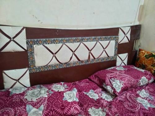 Bed with matress and cupboard