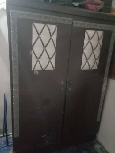 Bed with matress and cupboard