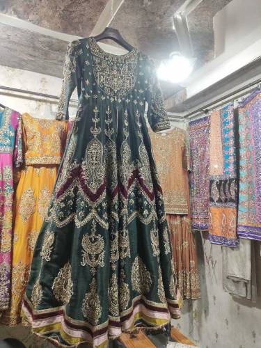 This is a green color maxi with a tissue lehenga underneath it plus