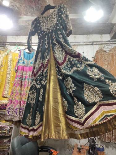 This is a green color maxi with a tissue lehenga underneath it plus