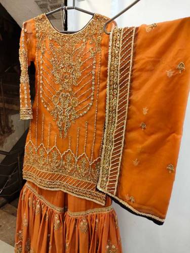 This is a Rust Color Gharara set Its gharara is of raw silk and shart 