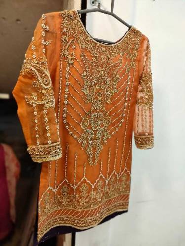 This is a Rust Color Gharara set Its gharara is of raw silk and shart 