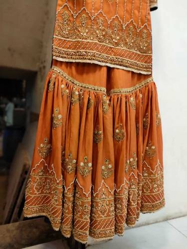 This is a Rust Color Gharara set Its gharara is of raw silk and shart 