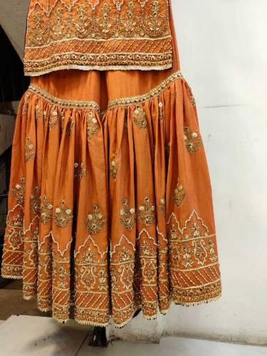 This is a Rust Color Gharara set Its gharara is of raw silk and shart 