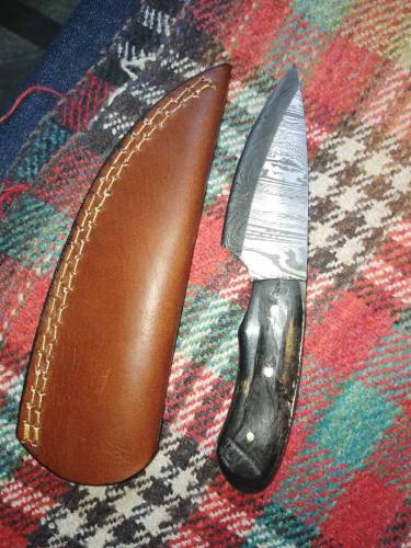 damascus knife whit lather cover