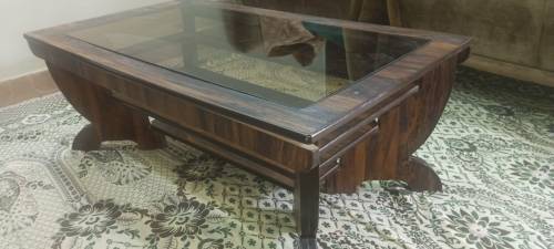 rectangular wooden table with glass in middle 