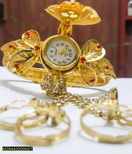 woman's golden watch 