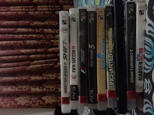 PS3 SLIM with 17 cds and 2 controller one controller is damaged but wo