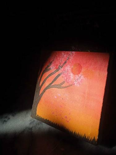 A beautiful painting of tree and sunset.