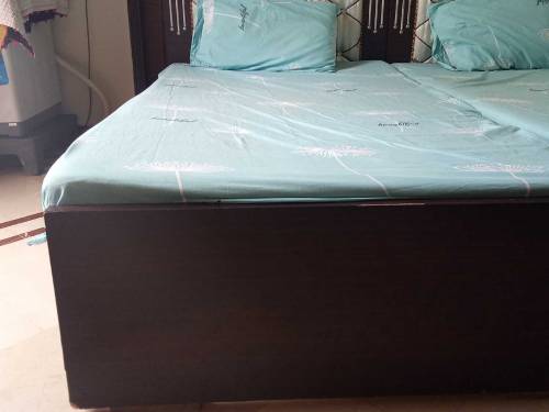 pair of single beds with mattress