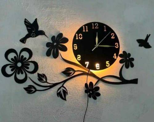 Analogue wall clock with lights